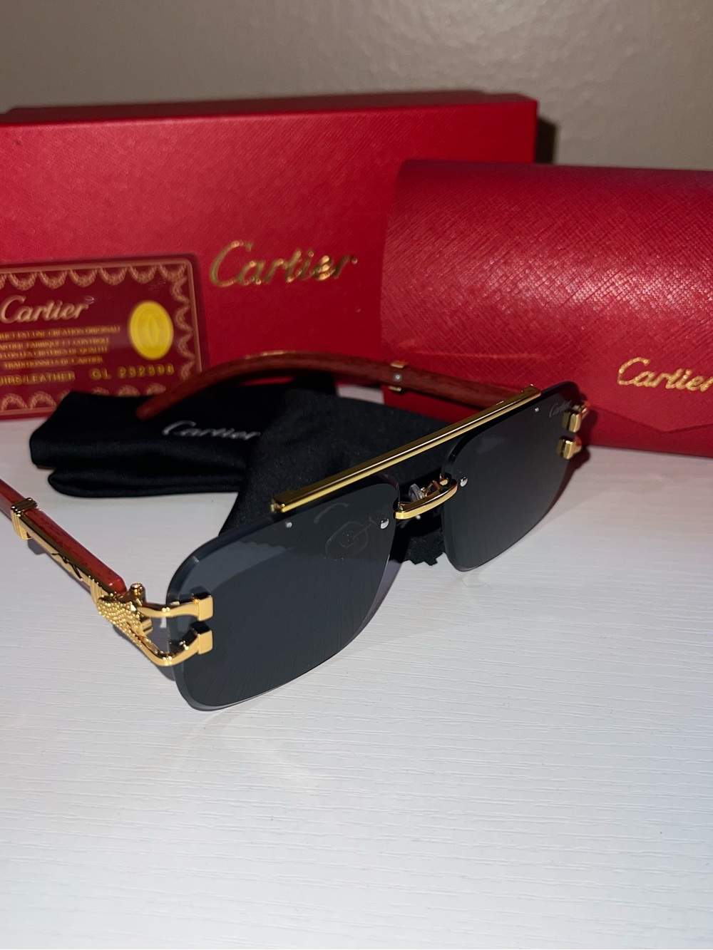 Cartier Women’s Rimless Black Lenses with Gold Trim Sunglasses